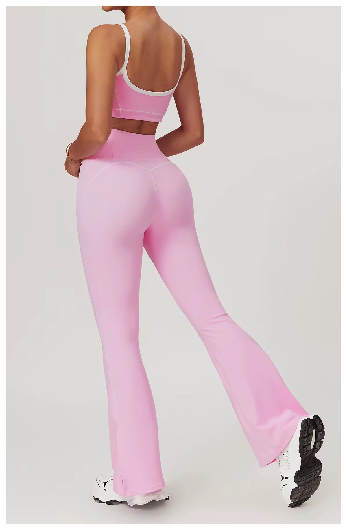 ensemble deux pièces de sport pour femme brassière et pantalon flaire rose