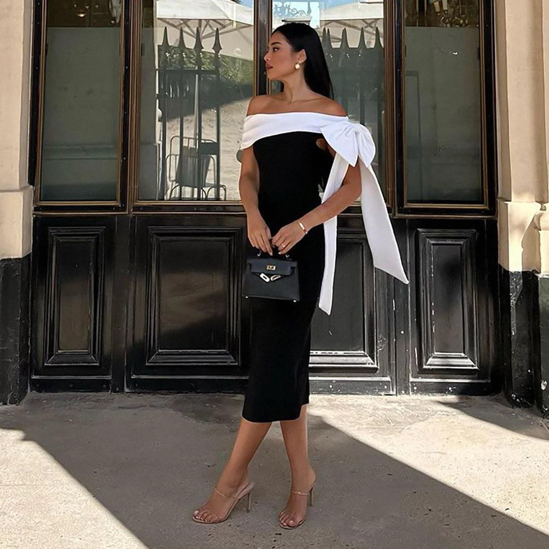 robe de soirée en bandage de haute qualité noire et blanche  épaule drapée longueur midi 